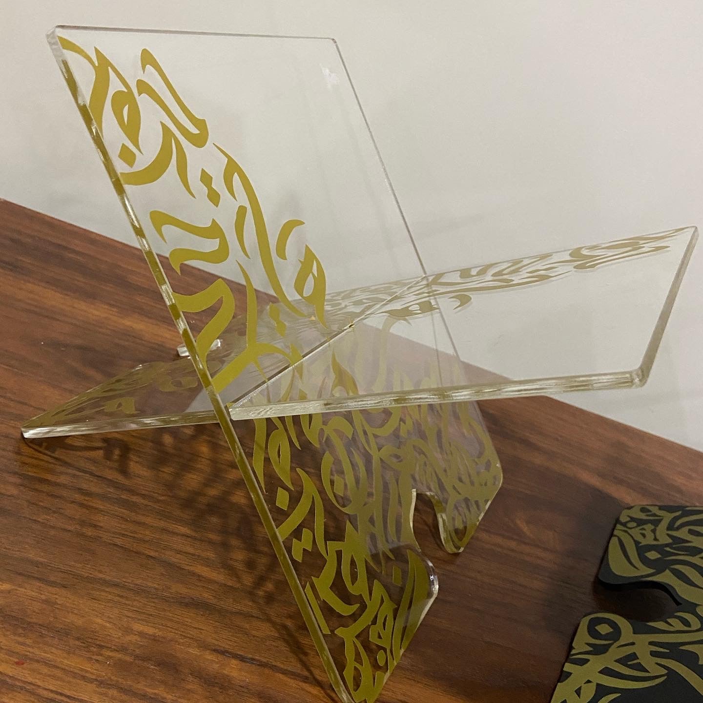 Clear Qur'an Stand with Arabic calligraphy